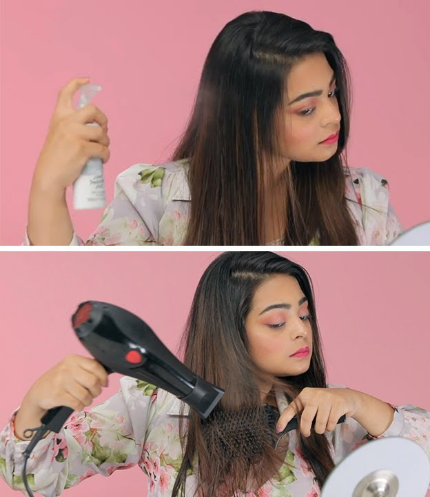 Woman using heat protection spray and blow dryer to dry her hair